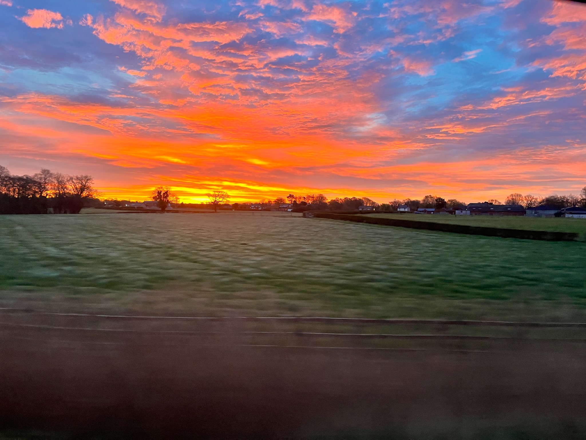 Vivid sunrise over fields near Knutsford in April 2026